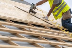 Treatment during engineered wood product manufacture